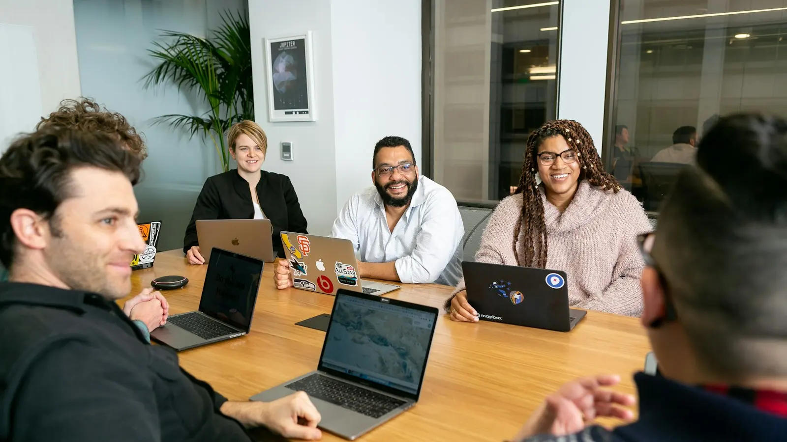Marketing team discussing a lead generation plan at a table